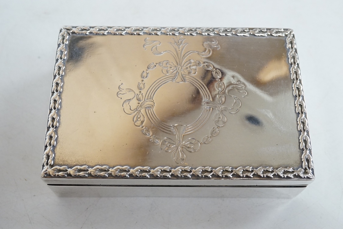 A small George V silver box and cover, possibly for snuff, by Mappin & Webb, London, 1912, 95mm, together with a later engine turned silver cigarette case, 10.6oz.